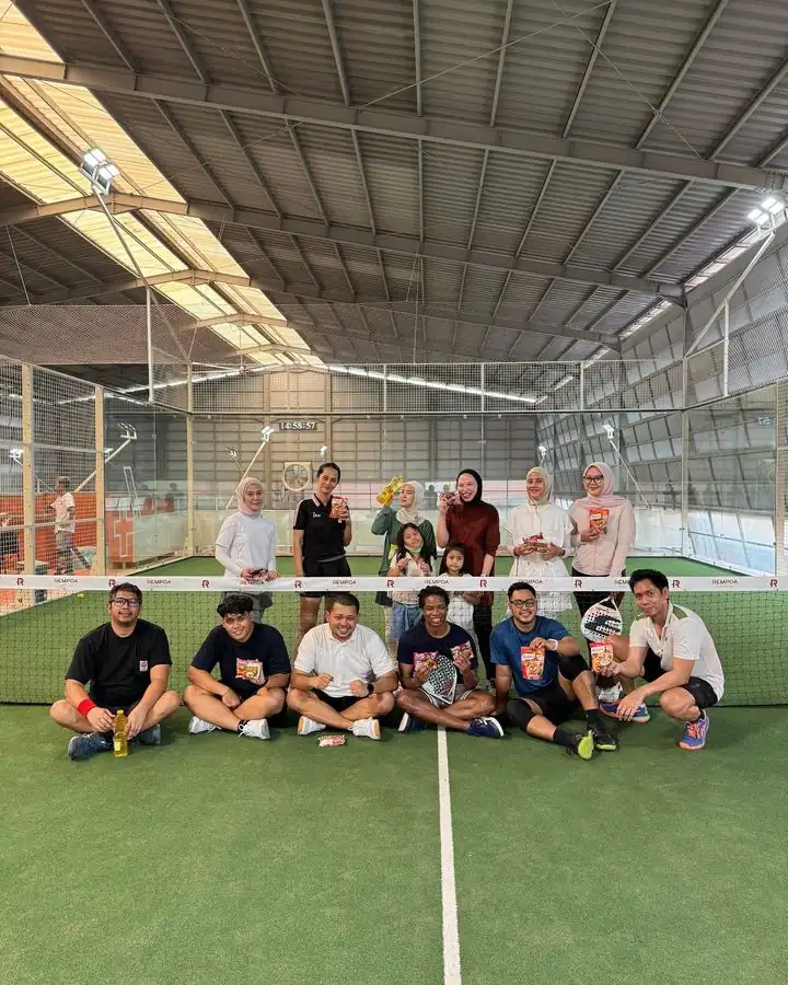 A group of players posing together on court