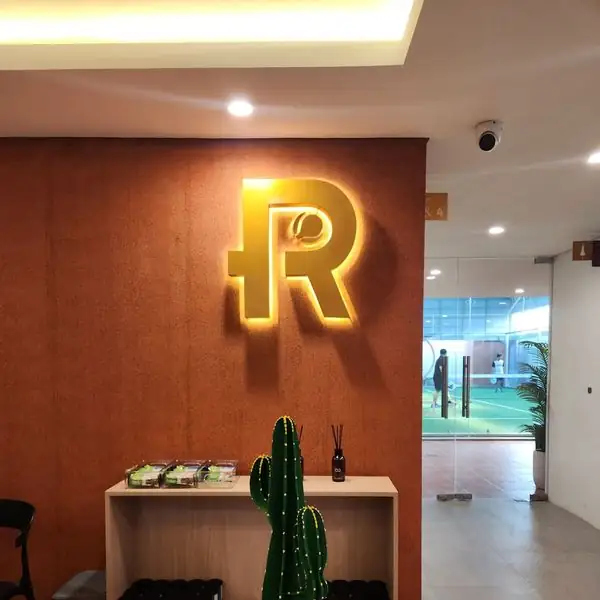 The gold R crest above the front desk
